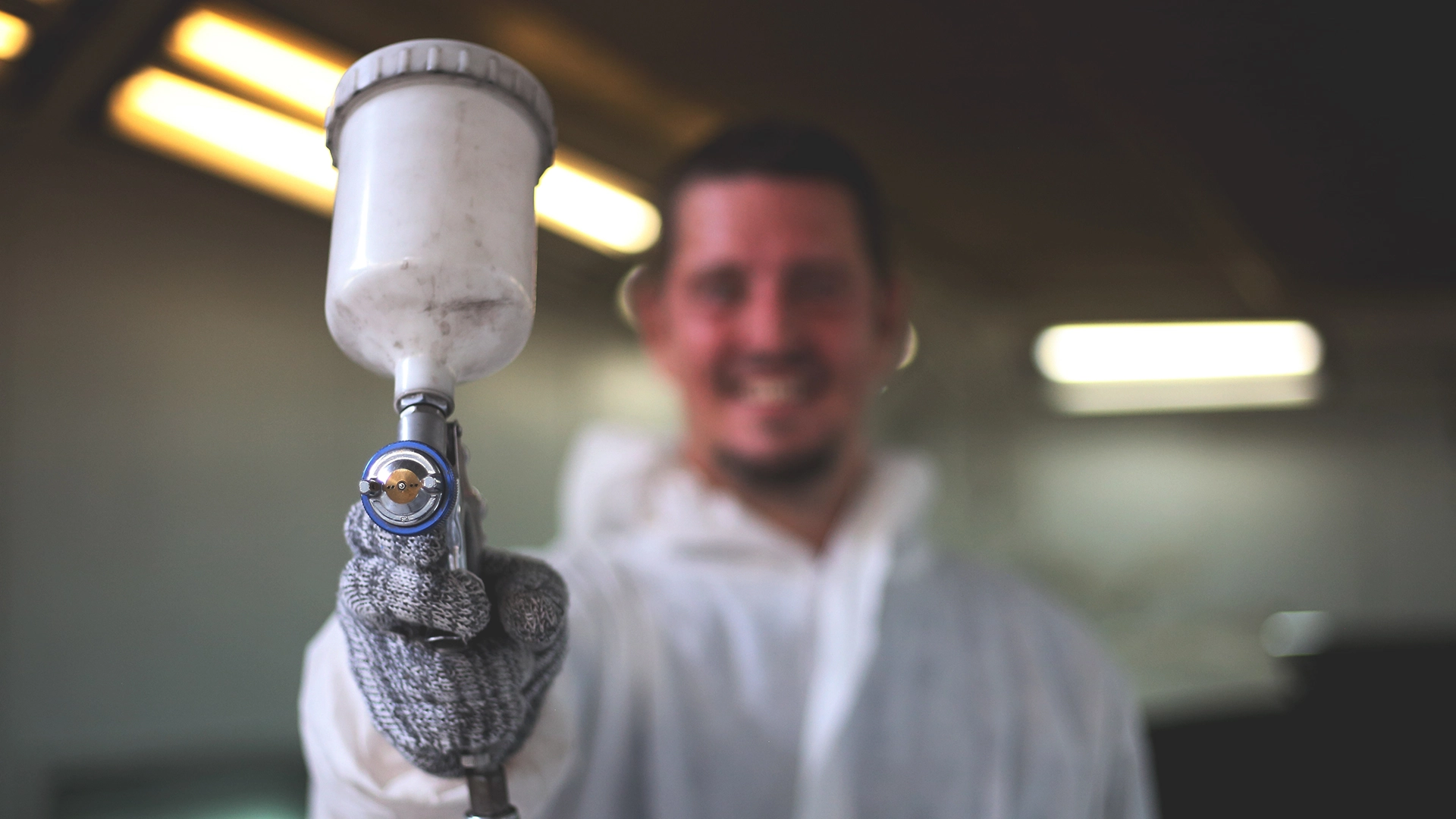 mechanic worker painting car, spray gun, fastmovers